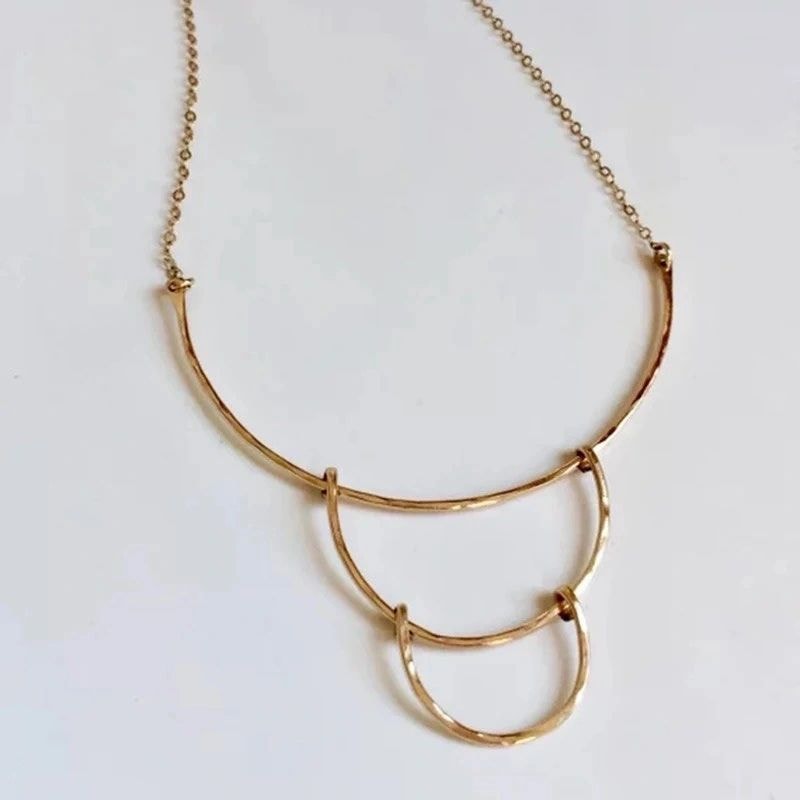 Gold layered arc necklace minimalist design